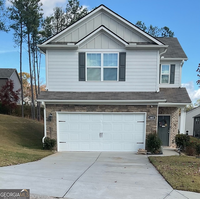 view of front of property featuring a front lawn and a garage