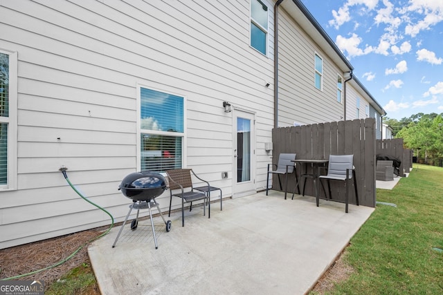 view of patio / terrace featuring fence