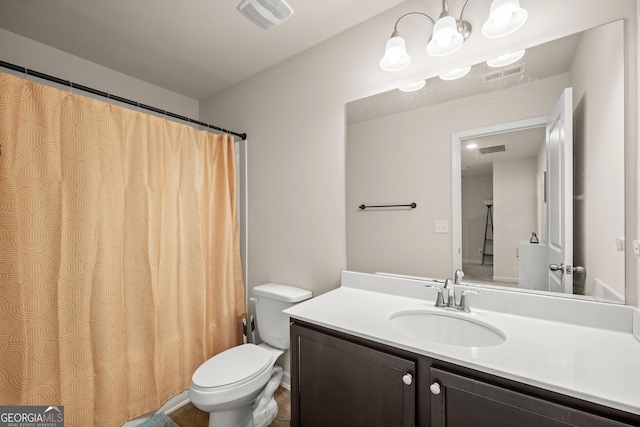 full bathroom with vanity, toilet, and visible vents