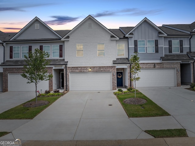 townhome / multi-family property featuring a garage