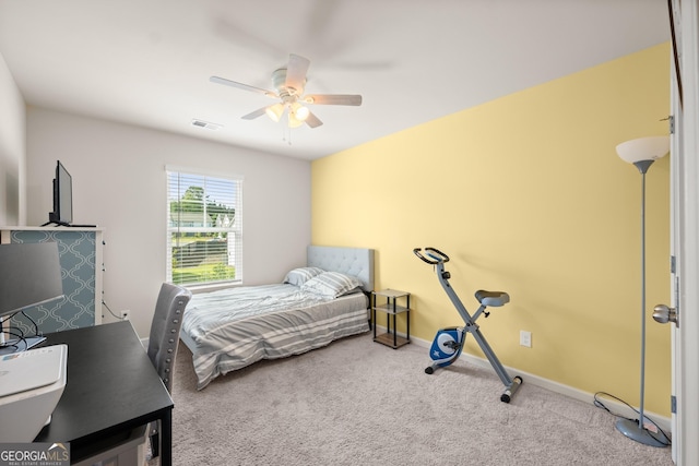 bedroom with visible vents, a ceiling fan, baseboards, and carpet floors