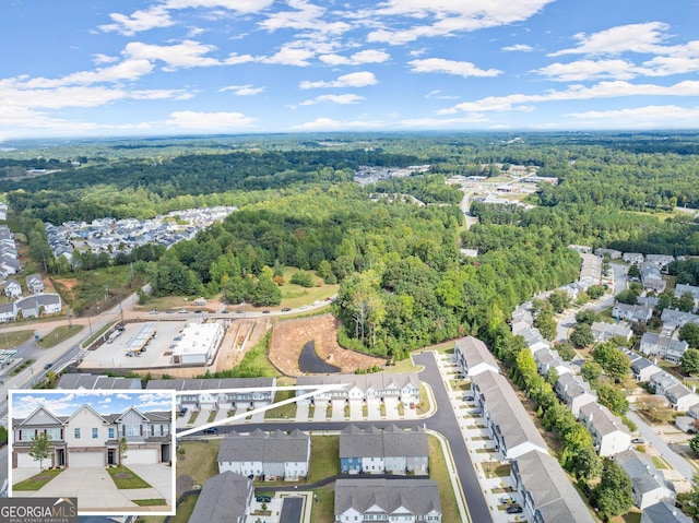 birds eye view of property with a residential view and a forest view