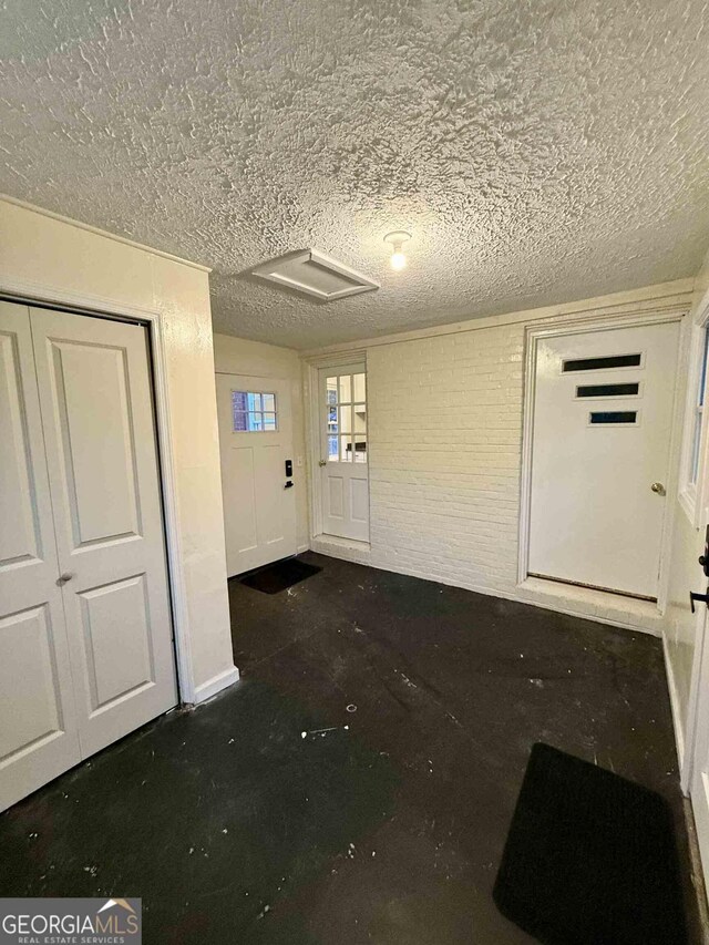 basement with a textured ceiling