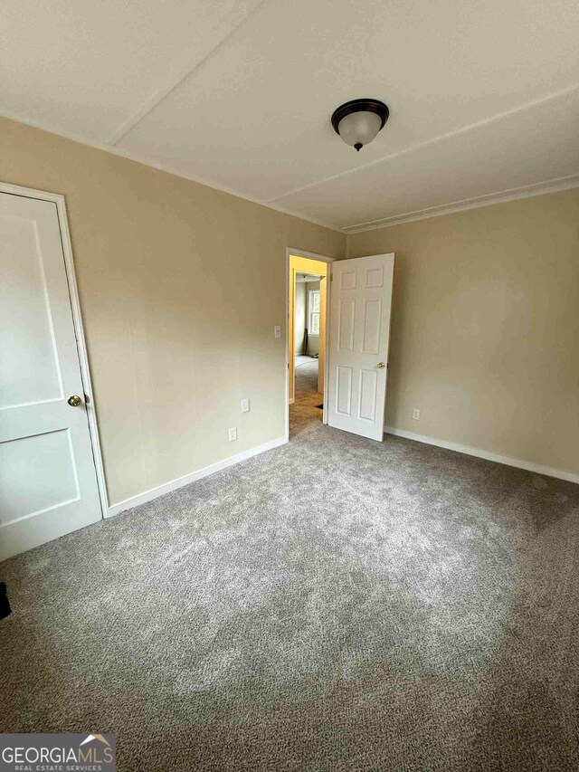 unfurnished bedroom featuring carpet flooring