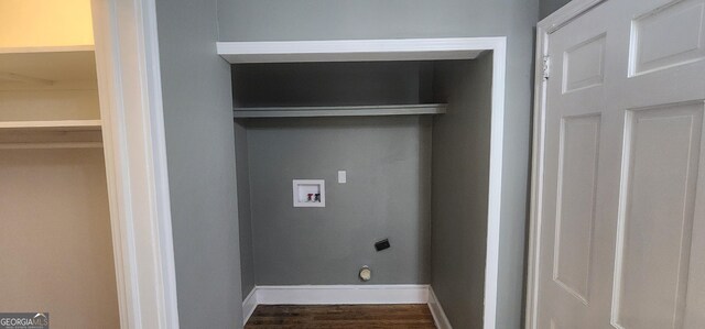 clothes washing area featuring washer hookup, electric dryer hookup, and hardwood / wood-style flooring