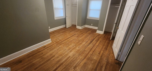 unfurnished bedroom featuring hardwood / wood-style flooring