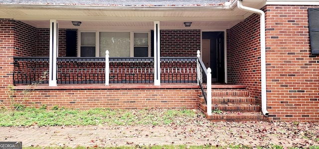 entrance to property with a porch