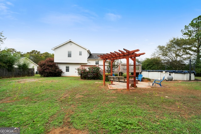 view of yard with a covered pool, a patio, and a pergola