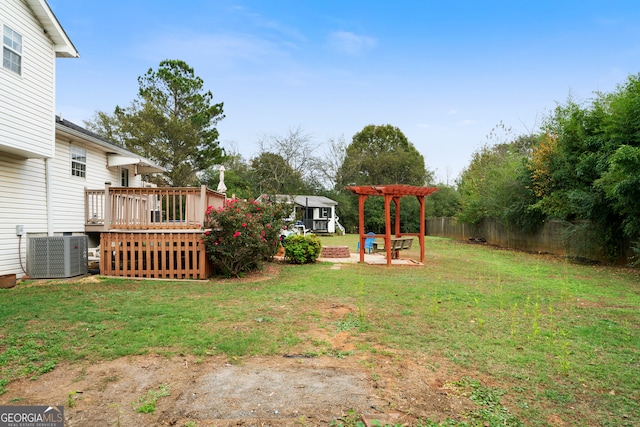 view of yard with a wooden deck and cooling unit