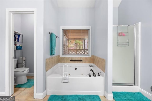 bathroom featuring tile patterned floors, toilet, and shower with separate bathtub