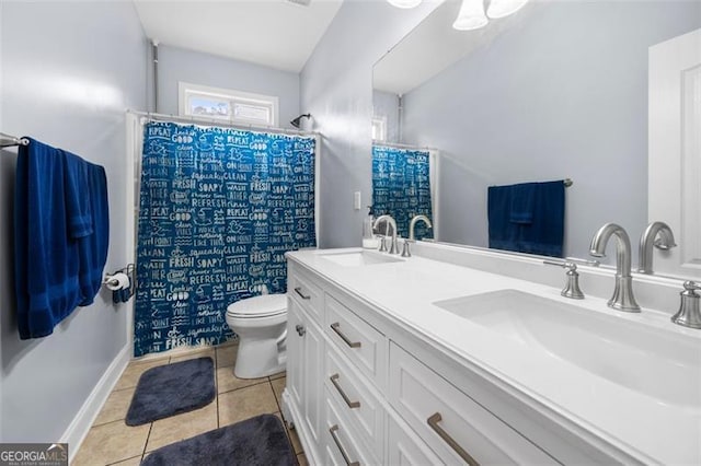 bathroom featuring vanity, curtained shower, tile patterned floors, and toilet