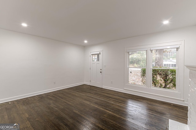 empty room featuring dark hardwood / wood-style floors