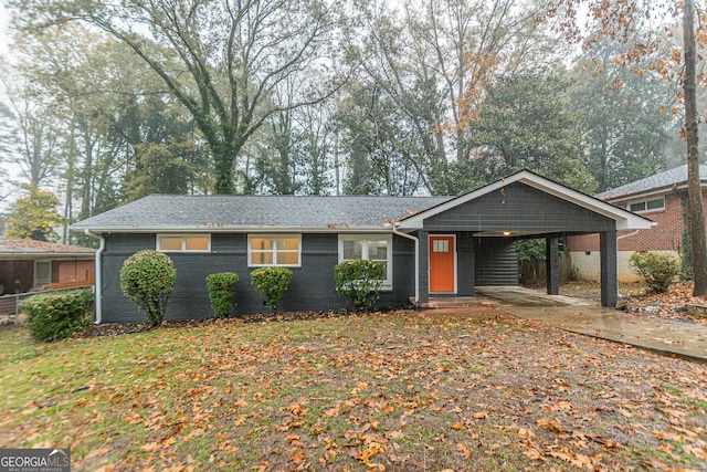 ranch-style home with a carport