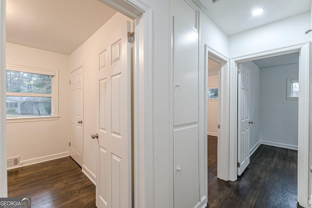 corridor featuring dark hardwood / wood-style flooring