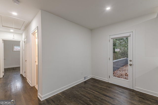 unfurnished room with dark hardwood / wood-style floors