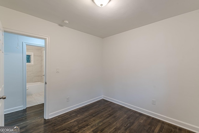 empty room featuring dark hardwood / wood-style floors