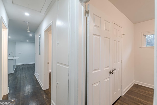 corridor featuring dark hardwood / wood-style flooring