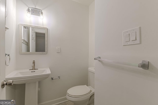 bathroom with sink and toilet