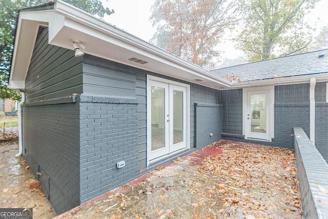 view of side of property with french doors