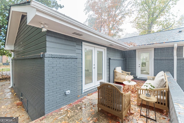 exterior space with an outdoor living space and french doors