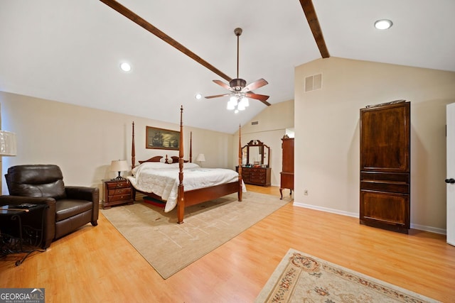 bedroom featuring ceiling fan, lofted ceiling with beams, and light wood-type flooring