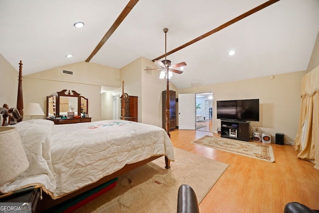 bedroom featuring ceiling fan, vaulted ceiling, and light wood-type flooring