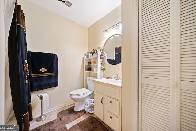 bathroom with vanity and toilet