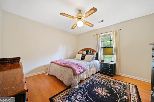 bedroom featuring hardwood / wood-style flooring and ceiling fan