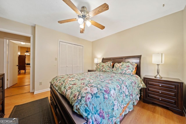 bedroom featuring light wood-type flooring, a closet, and ceiling fan