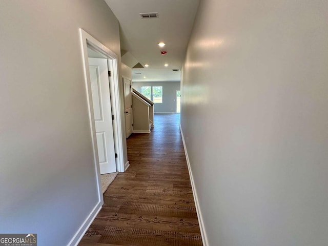 corridor with dark hardwood / wood-style floors