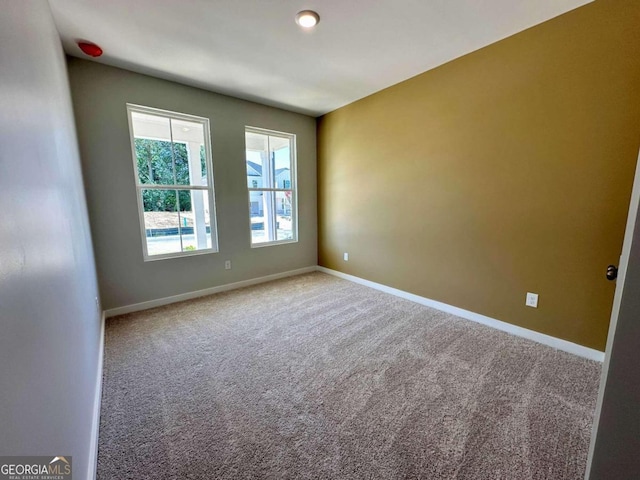 empty room with carpet flooring