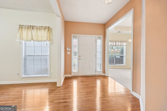 foyer entrance with light wood-type flooring