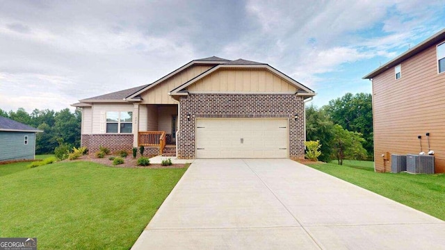 craftsman house featuring a garage and a front yard