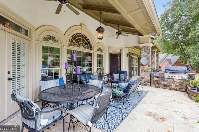 view of patio with ceiling fan, area for grilling, and an outdoor living space