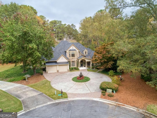 view of front of house with a front lawn and a garage