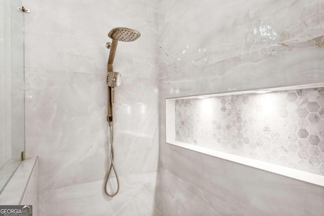 details with a tile shower