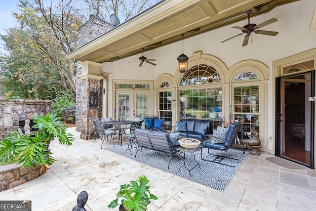 view of patio featuring ceiling fan and french doors