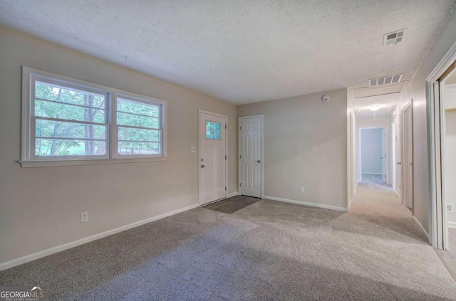 interior space with a textured ceiling