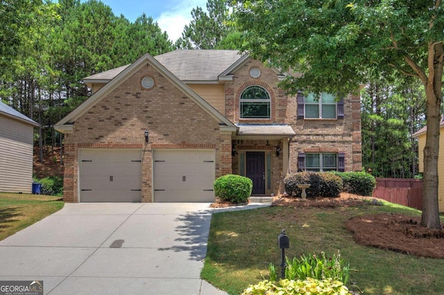 view of front facade featuring a garage and a front yard