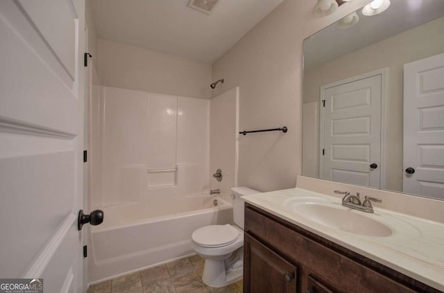 full bathroom featuring vanity, washtub / shower combination, and toilet