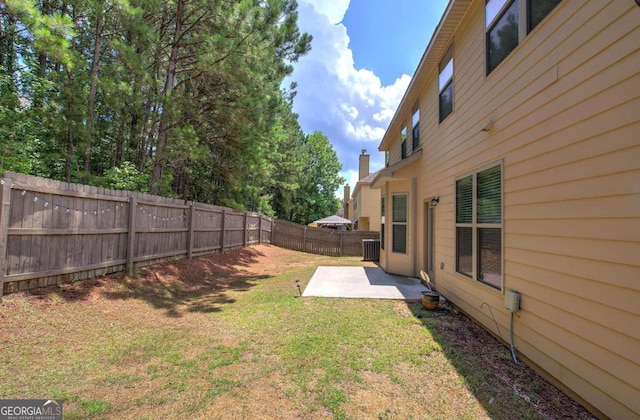 view of yard with a patio area and central AC