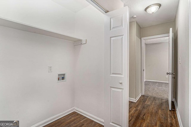 laundry area featuring dark hardwood / wood-style flooring and washer hookup