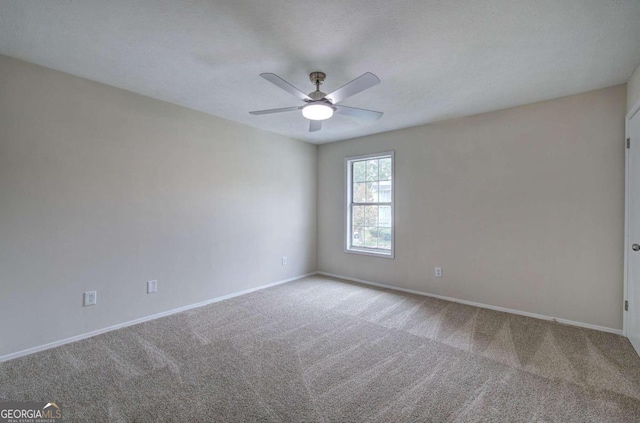 unfurnished room featuring ceiling fan, a textured ceiling, and carpet flooring