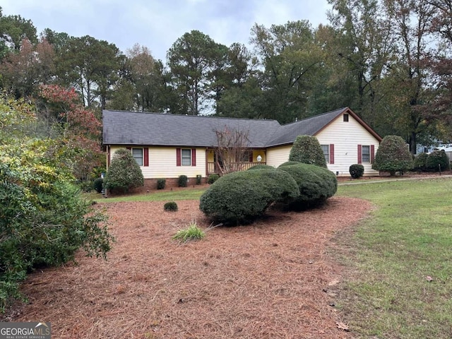 ranch-style house with a front yard