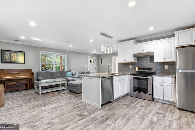 kitchen with kitchen peninsula, white cabinetry, stainless steel appliances, and pendant lighting