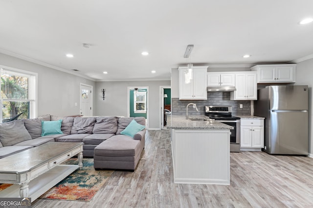 kitchen featuring stainless steel appliances, crown molding, sink, white cabinets, and light hardwood / wood-style floors