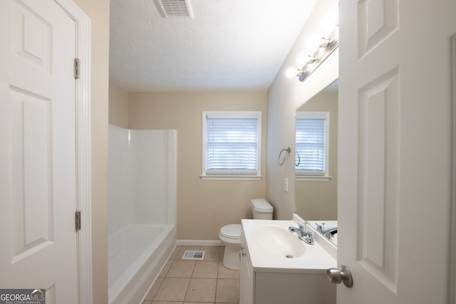 full bathroom featuring a textured ceiling, independent shower and bath, vanity, tile patterned floors, and toilet