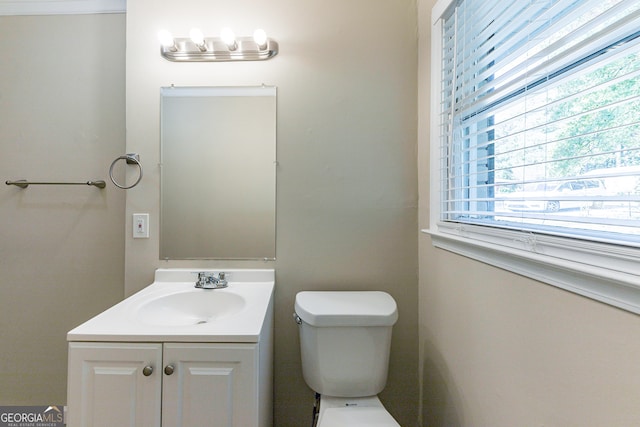 bathroom featuring toilet and vanity