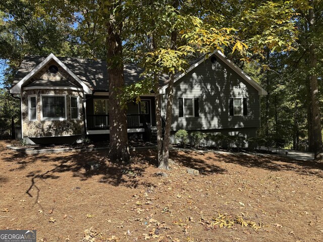 back of property featuring a wooden deck