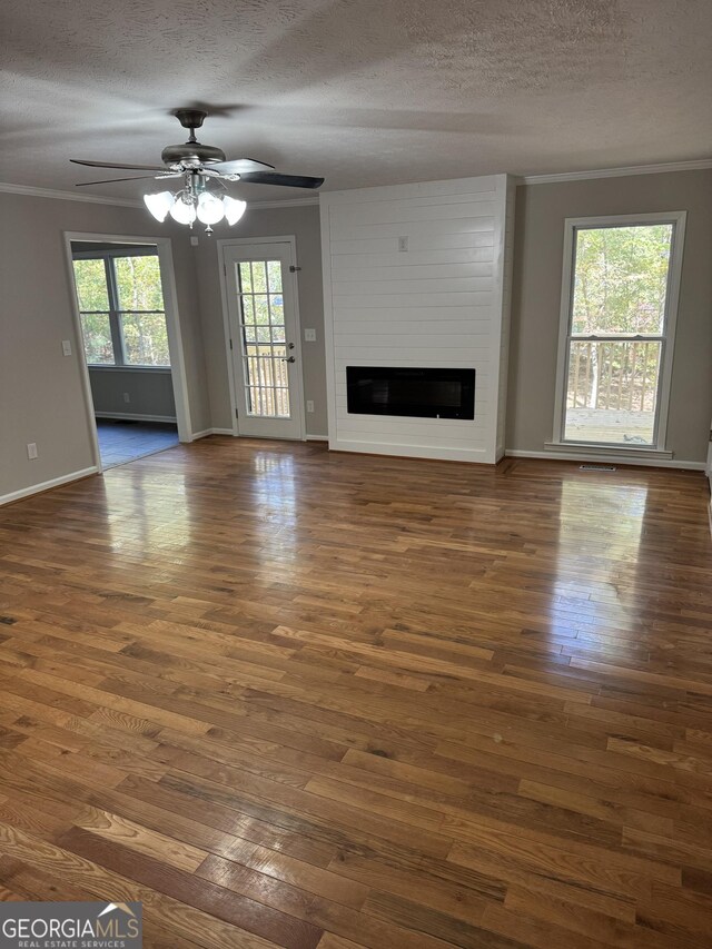 unfurnished room with dark wood-type flooring and ornamental molding